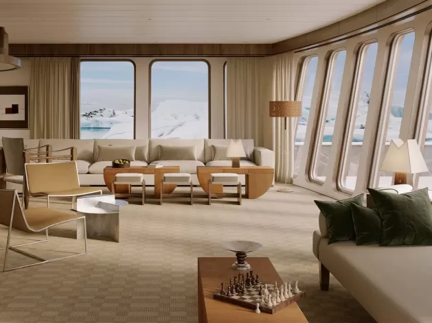 Luxurious living room with large windows showcasing an arctic landscape. The décor features neutral tones, modern furniture, a chess set on a wooden table, and two abstract paintings. Natural light fills the space.