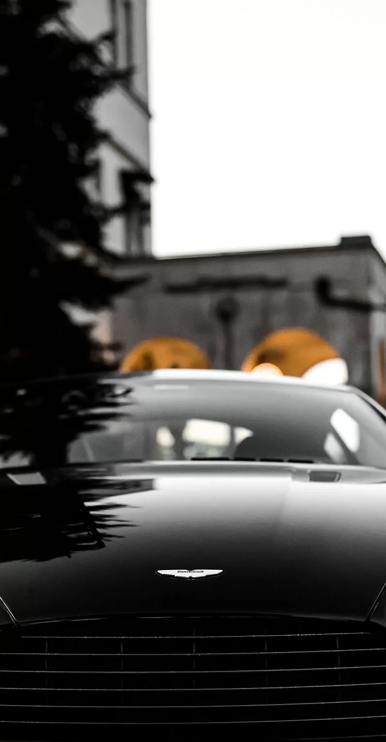 Front of black Aston Martin sports car