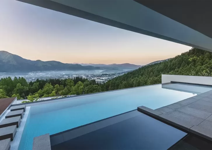 Hillside luxury resort pool with view at Enowa in Yufuin, Japan