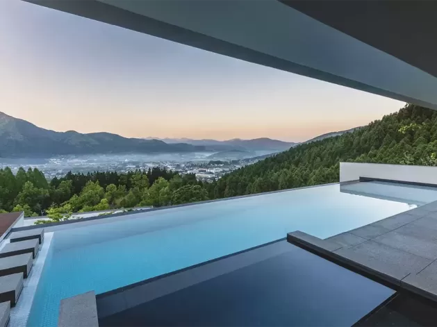 Hillside luxury resort pool with view at Enowa in Yufuin, Japan