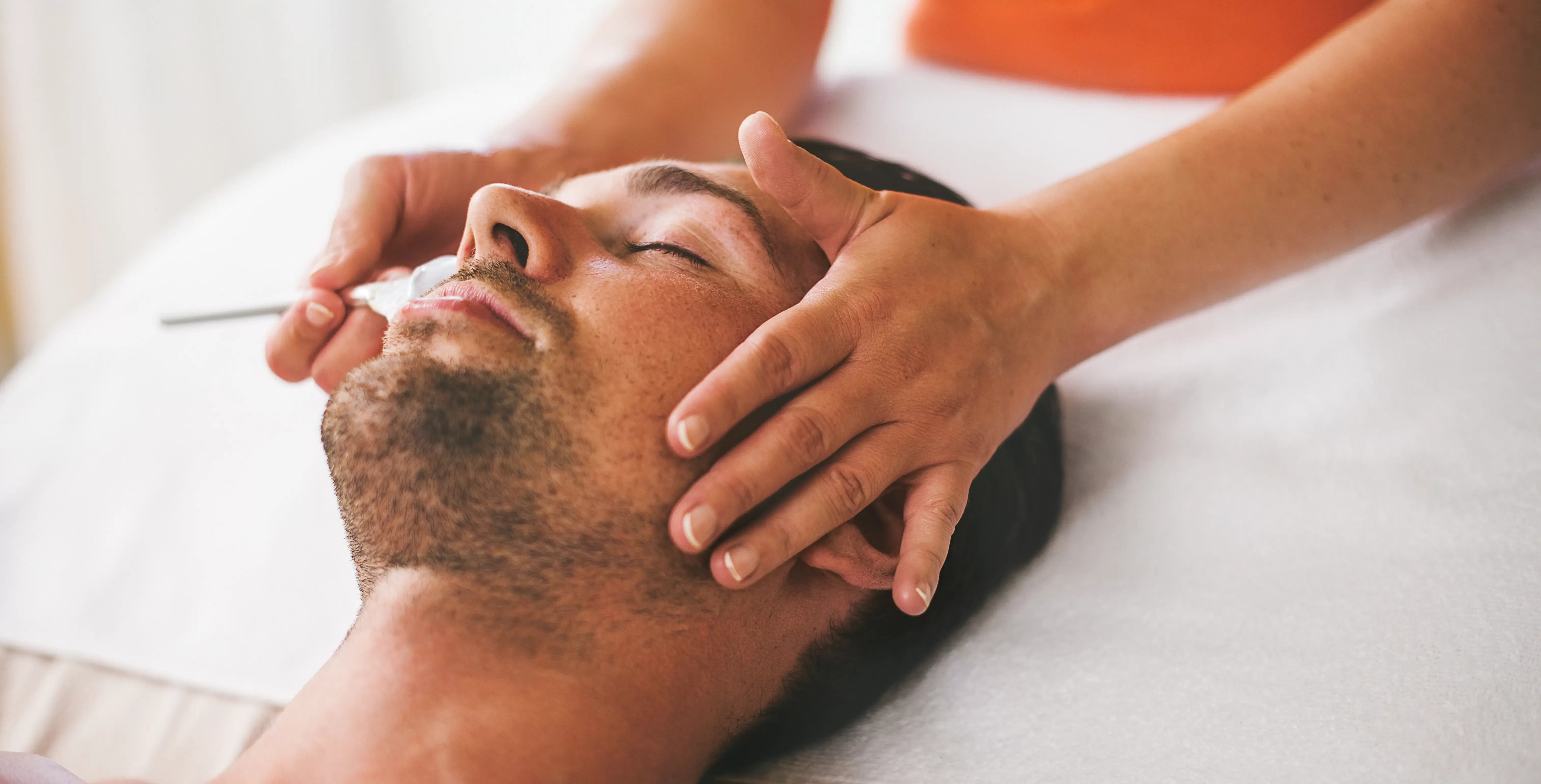 Man receiving facial