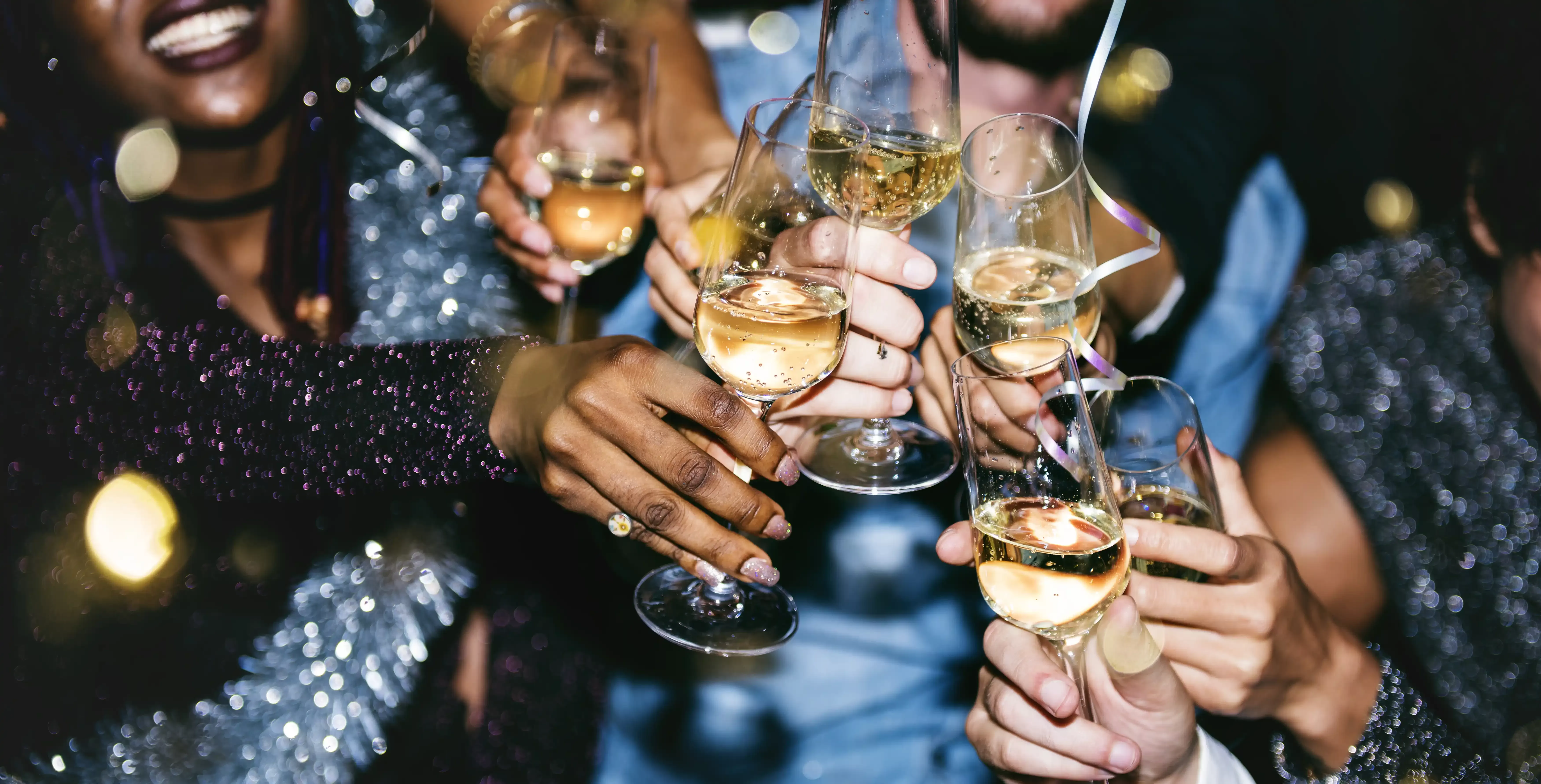 People cheers-ing with champagne glasses