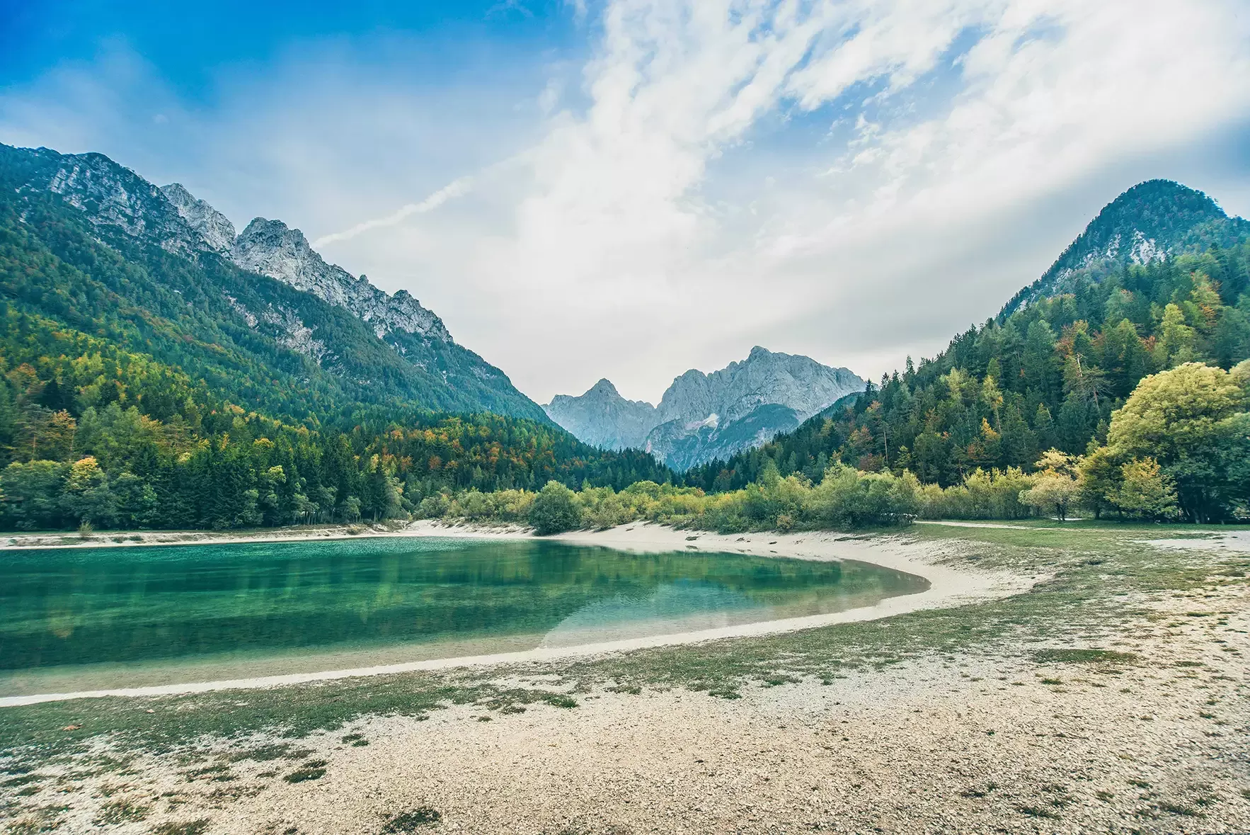 View of blue Lake Jasna with mountains in Slovenia